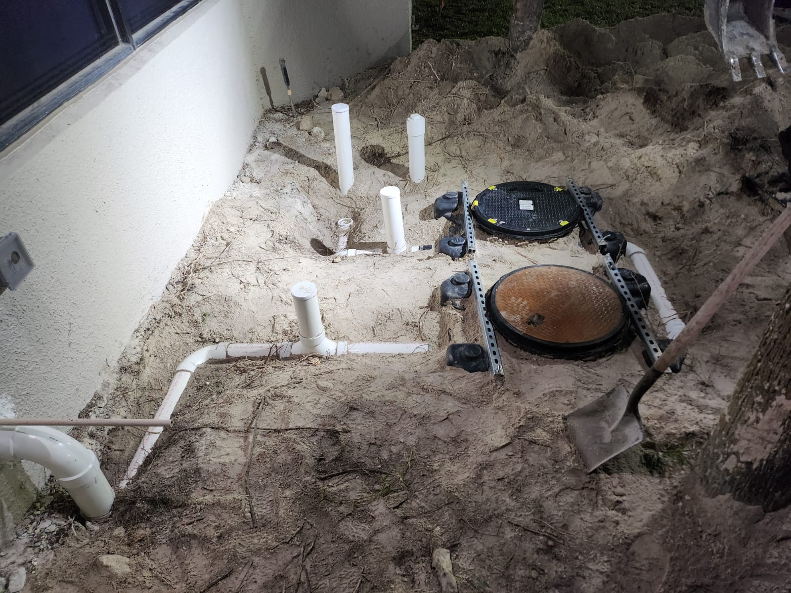 Installed grease trap piping and lids at Global Meat Market