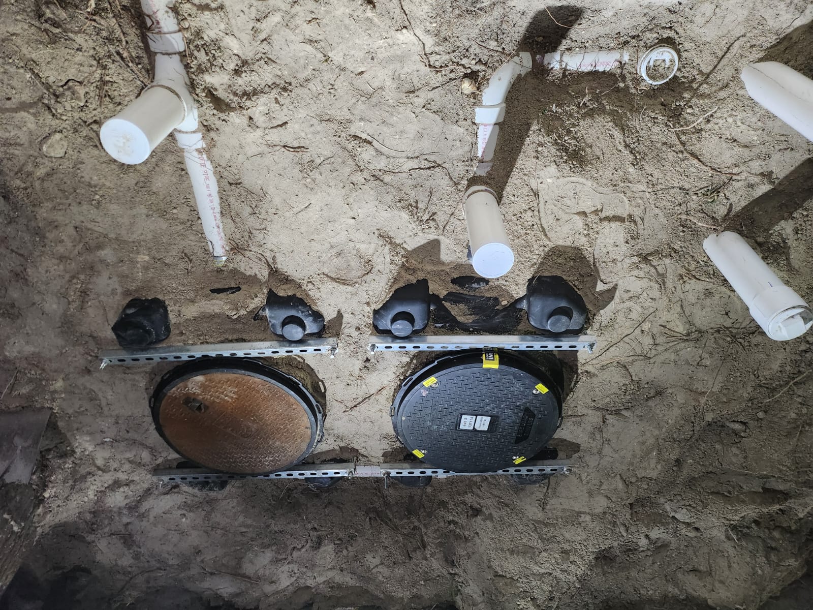 Overhead view of grease trap installation piping layout
